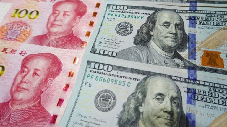 Chinese yuan: Currency hits record lows against US dollar