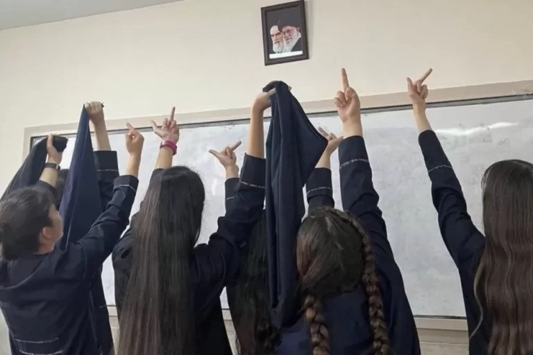 Iran schoolgirls remove hijabs in protests against government
